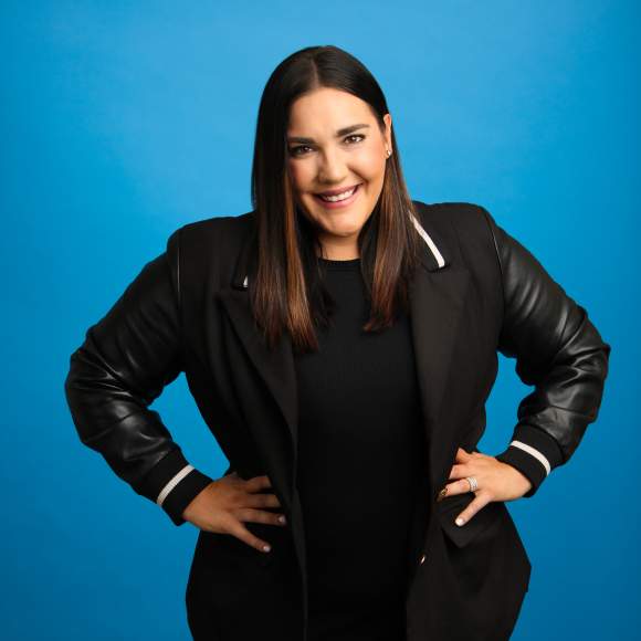 Abby Anderson headshot on blue background