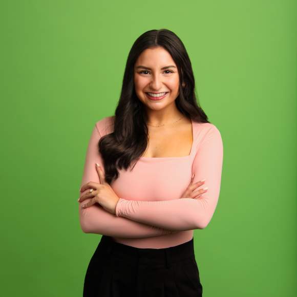 Hannah Decker headshot on green background