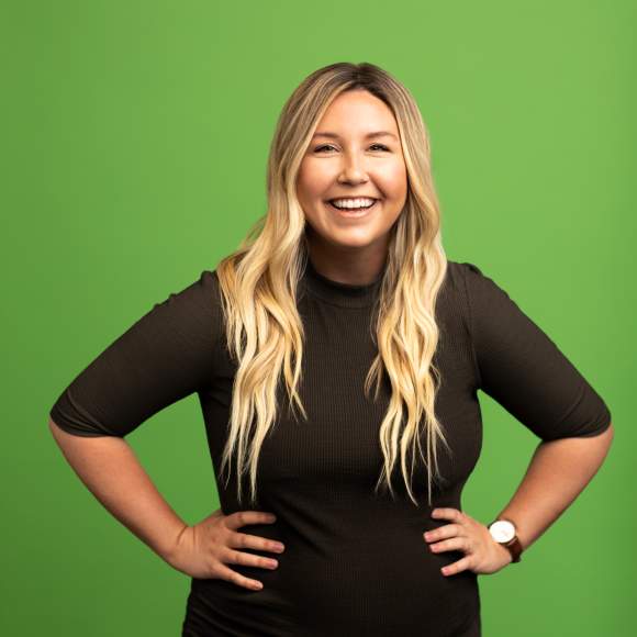 Meg Berno headshot on green background