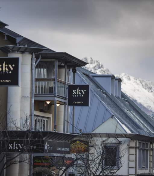 Outside view of Sky City Casino with snowy mountains in the background