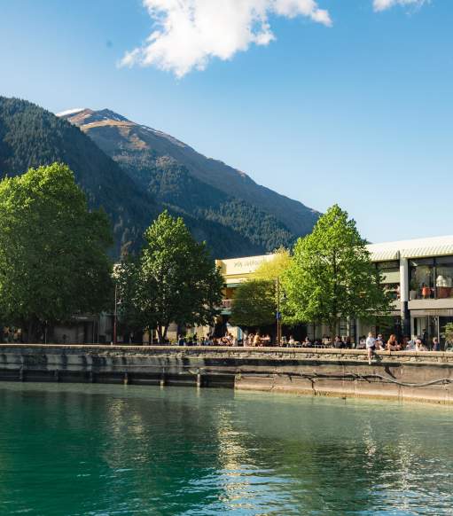 View from the lake looking at Queenstown Bay and busy waterfront