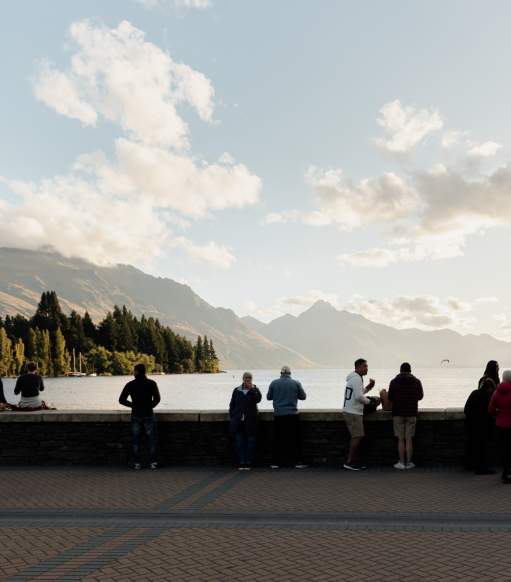 Queenstown Bay at dusk with mountains in the background