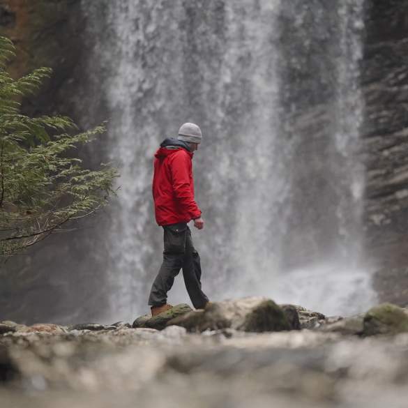 A man by a waterfall.