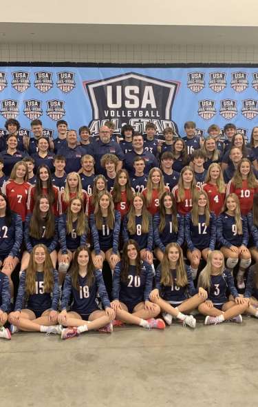 A team photo of volleyball players that are a part of the USA Volleyball All-Star Championships.