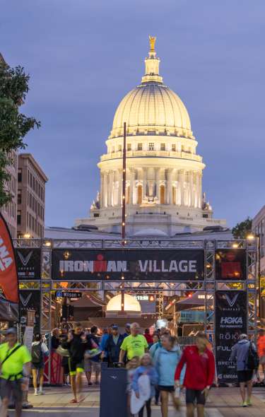 Ironman Village with the Capitol Building lit up behind it