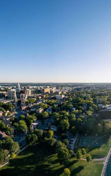 A drone photo of the city of Madison showing both lakes Monona and Mendota with the Capitol building in the center