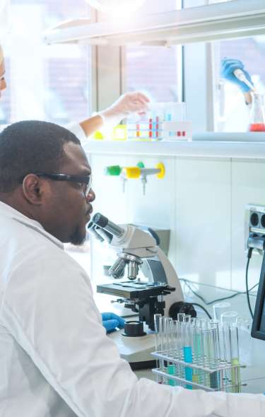 Doctor in laboratory working on computer