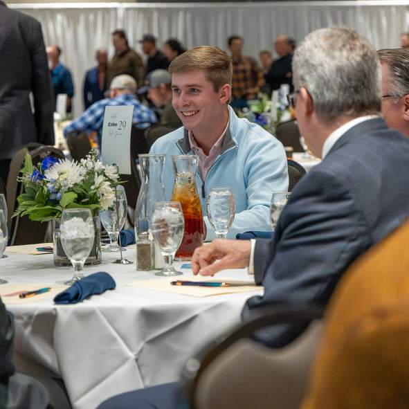 People at table with drinks at meeting event
