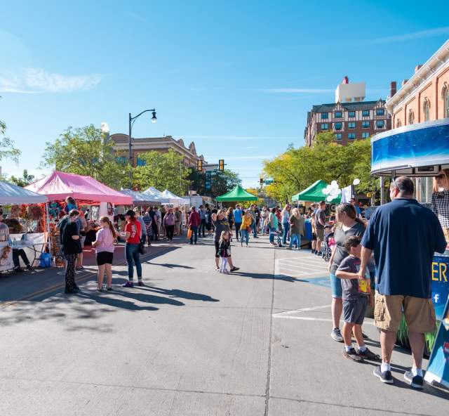 vendor booths on the street selling goods at the great downtown pumpkin festival in rapid city, sd