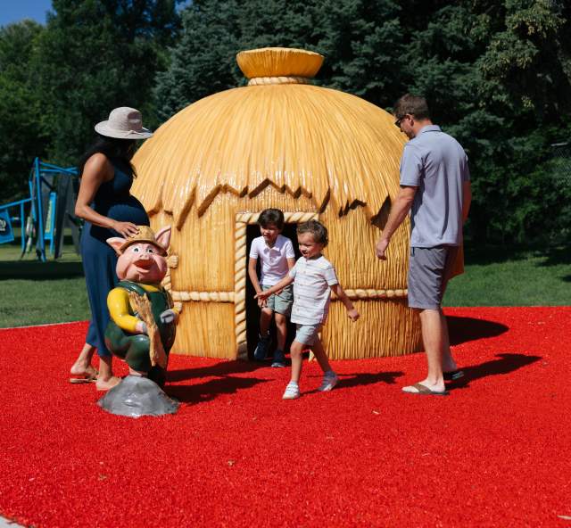 family playing in play set found at storybook island in rapid city, sd