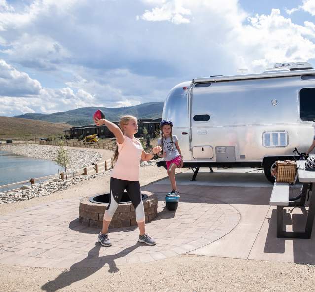 Kids playing in front of Airstream at River Run RV Resort