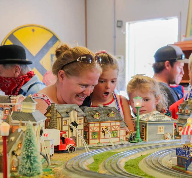 Parents and kids enjoying the Moffat Road Railroad Museum