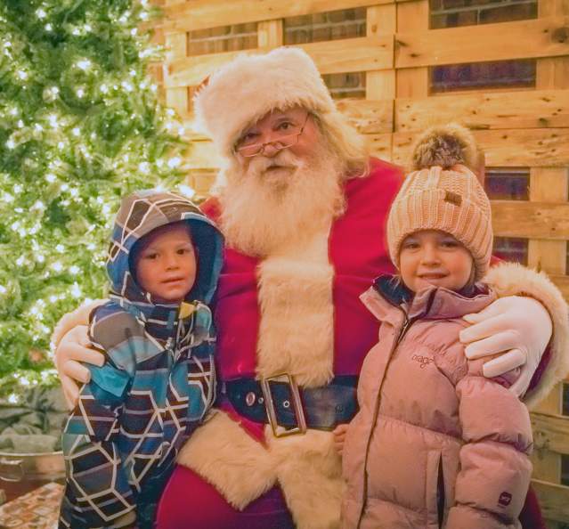 Santa and kids at holiday event