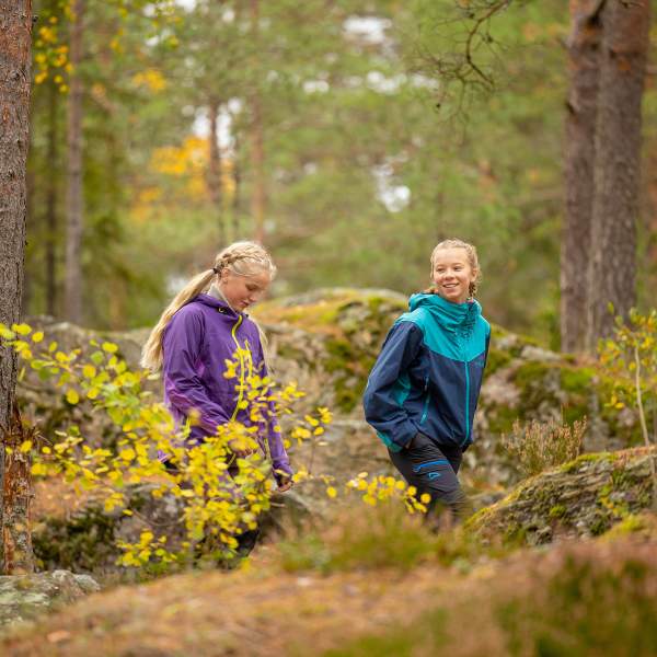 Two girls on a hike or walking tour in the forest near Børtevann in Østfold.