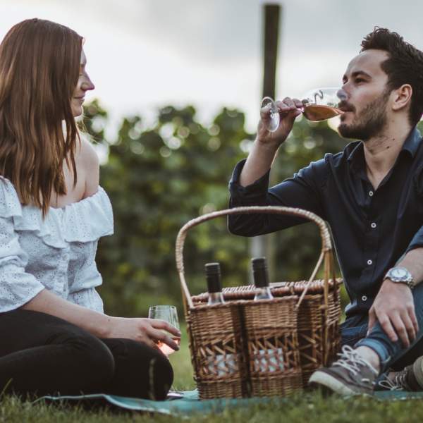 A couple enjoying a picnic at Little Wold Vineyard in East Yorkshire