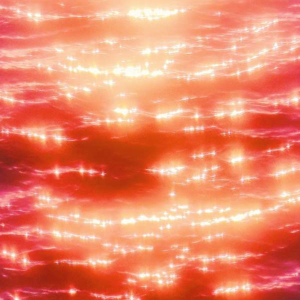Photograph of red, pink and orange-hued light on water