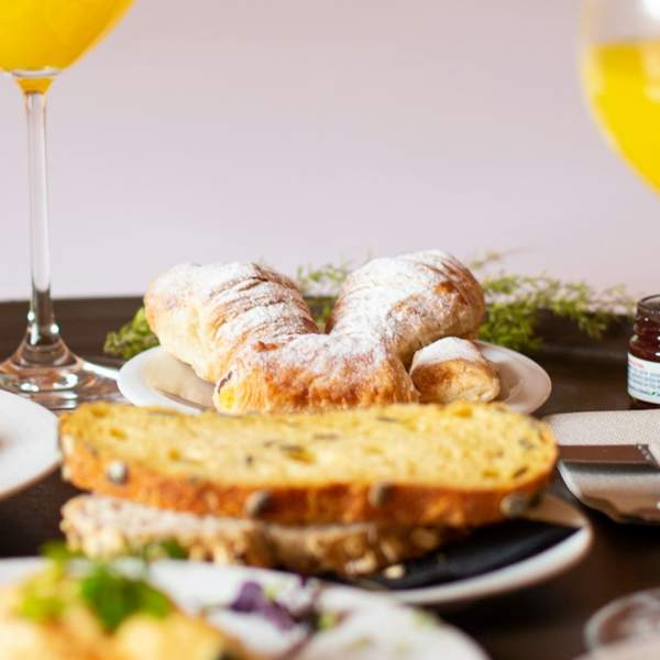 Breakfast items laid out on a bed