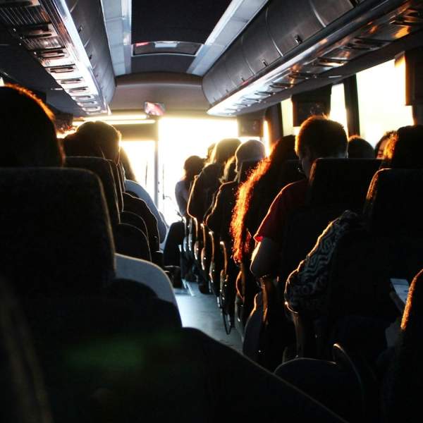 Photograph showing a packed coach full of people on a group trip
