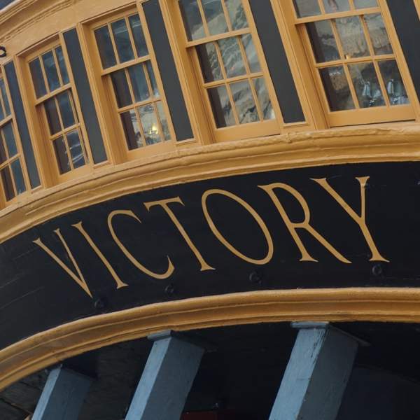 A photograph of HMS Victory showing the letter detailing close-up