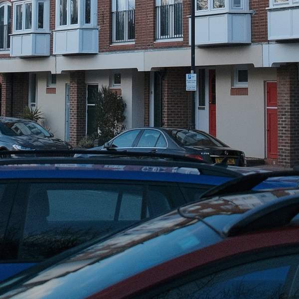 Photograph showing various cars parked along Broad Street in Old Portsmouth