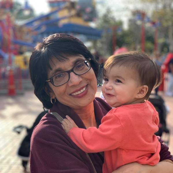 Adeta Gayah's mom, Barbara Gayah, holding her grandbaby.