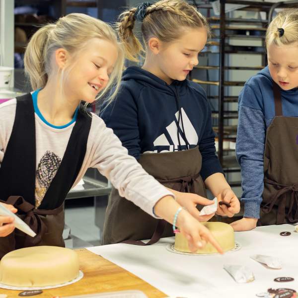 Kids decorating cakes during the Matlyst festival in Ringsaker