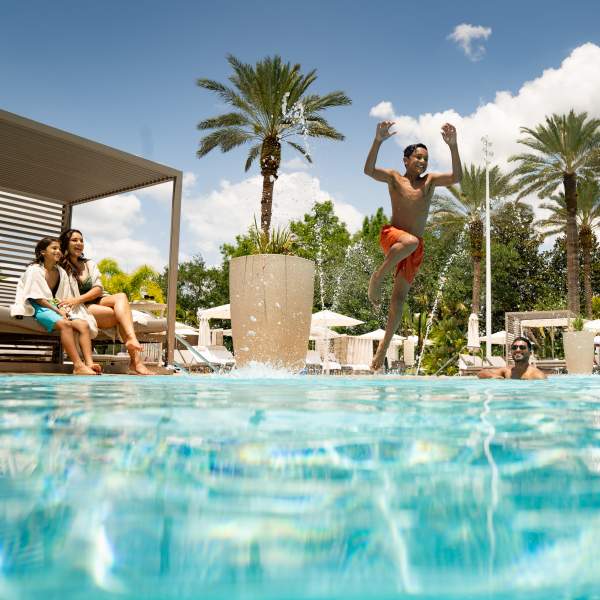 Family at pool at The Ritz-Carlton Orlando, Grande Lakes