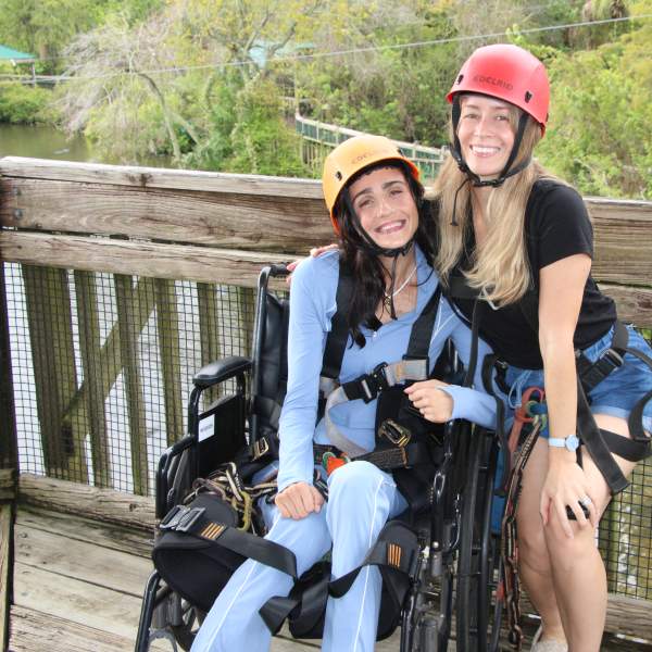 Accessibility influencer Amanda Perla experiences the Gator Gauntlet accessible zip line at Gatorland