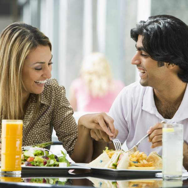 A hispanic couple enjoying a meal