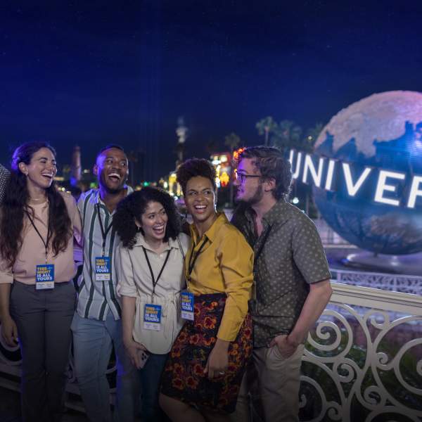 Group for meeting at Universal Orlando Resort by globe at night