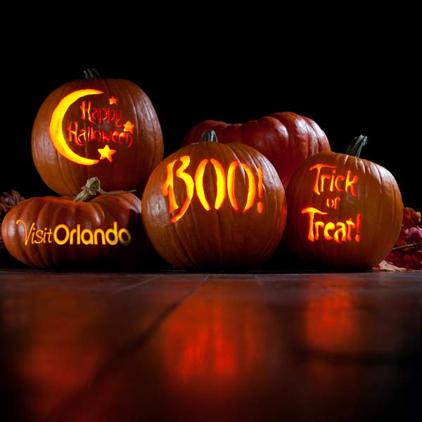 Pumpkins with Visit Orlando logo, Happy Halloween, Boo and Trick or Treat carved on them