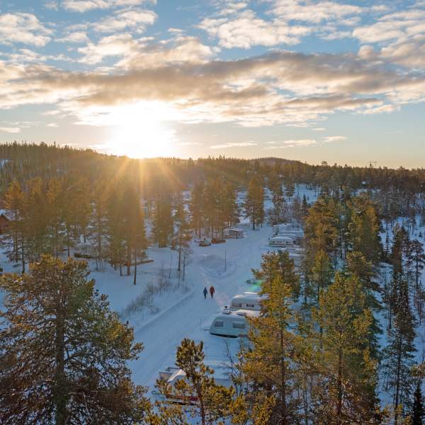 Drone photo with winter camping and a scenic sundown