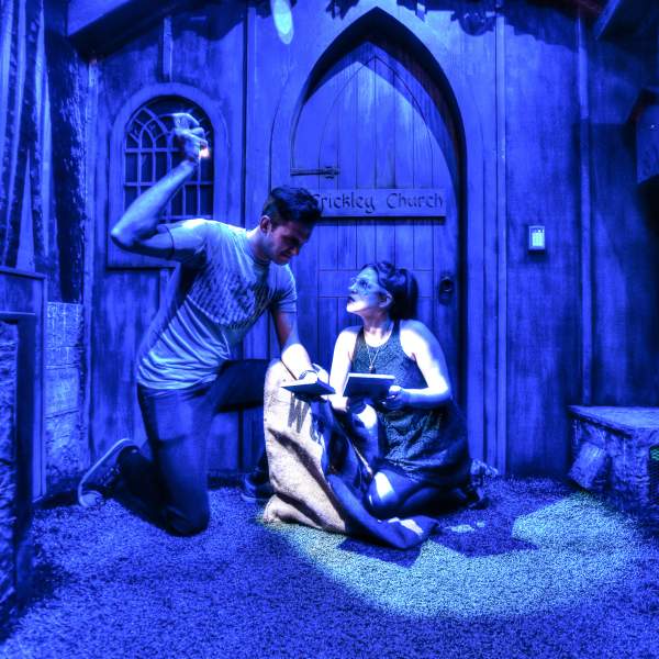 Escapology working to solve puzzle in 7 Deadly Sins room