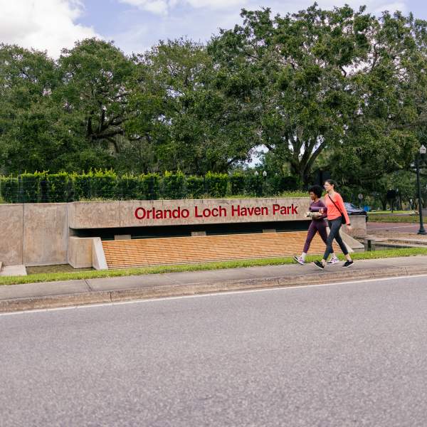 Walking by Loch Haven Park sign