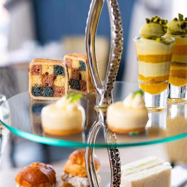 A picture showing afternoon tea cakes on a stand