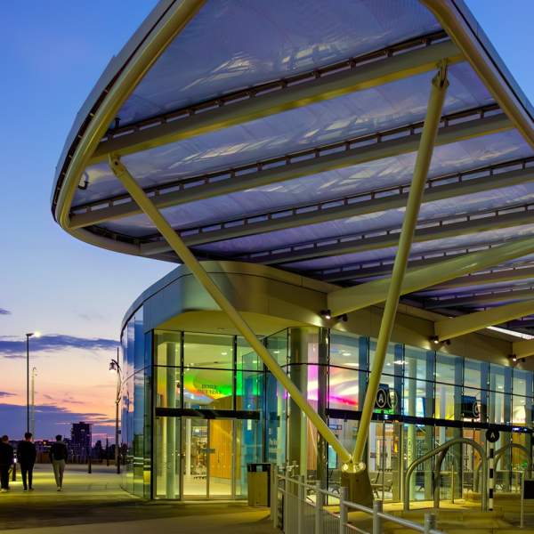 A photograph showing the Hard Interchange bus stop at dusk, from the outside
