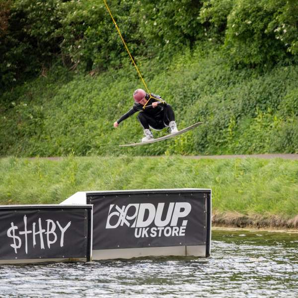 A wakeboarder performs a jump at South Coast Wakepark