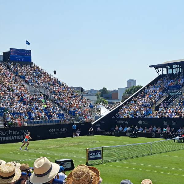 A tennis match played at Rothesay International tennis with busy crowds in the stands