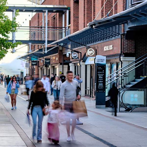 Photograph showing people walking around the edge of Central Square in Gunwharf Quays