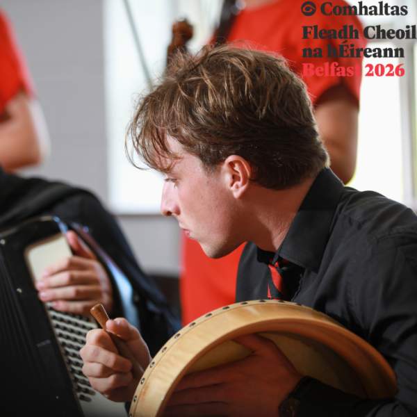 Musicians playing traditional Irish instruments as part of Fleadh