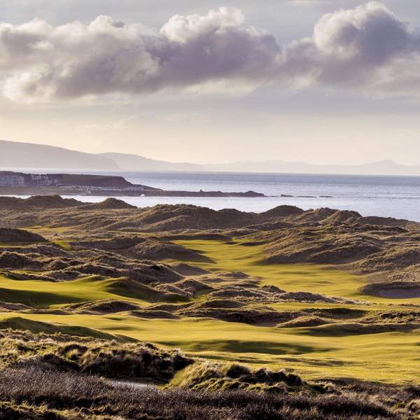 Aerial of the greens and fairways at Royal Portrush Golf Course overlooking the sea