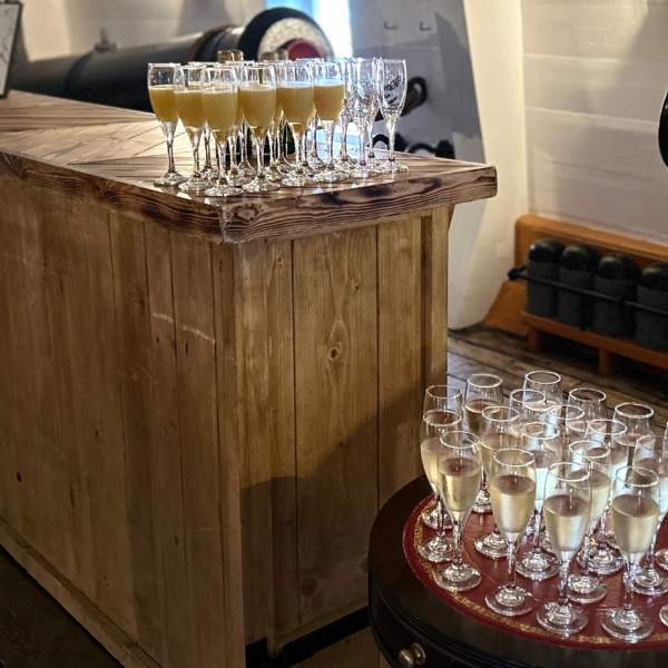 Filled Champagne glasses on offer for a corporate event at Portsmouth Historic Dockyard