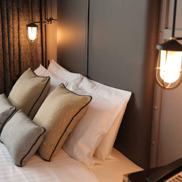 Modern, plush interior of a bedroom in the Titanic Hotel