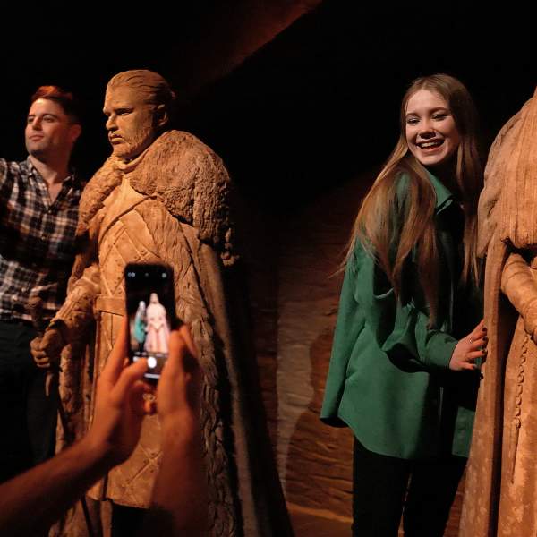 Visitors exploring the Crypts of Winterfell exhibition at the Game of Thrones Studio Tour.