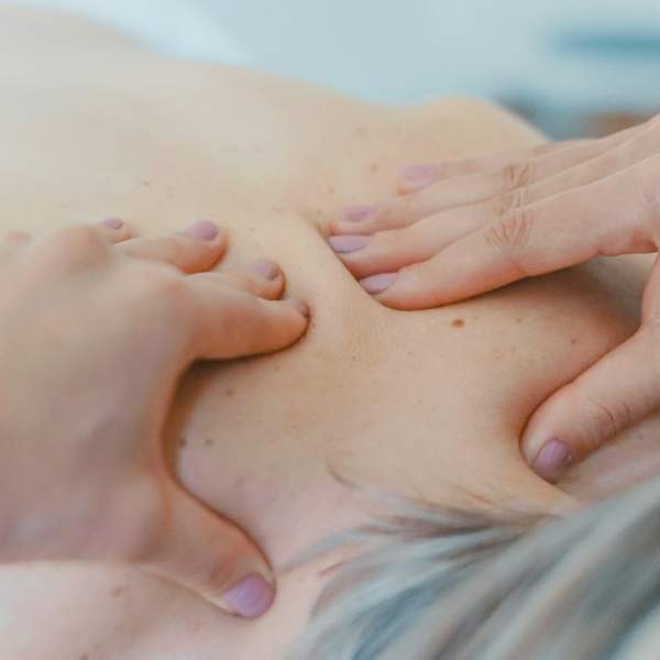 Photograph of a woman receiving a massage at a spa