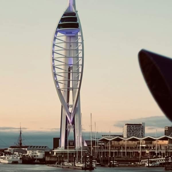 Photograph of the Spinnaker Tower with a viewfinder binoculars in the foreground