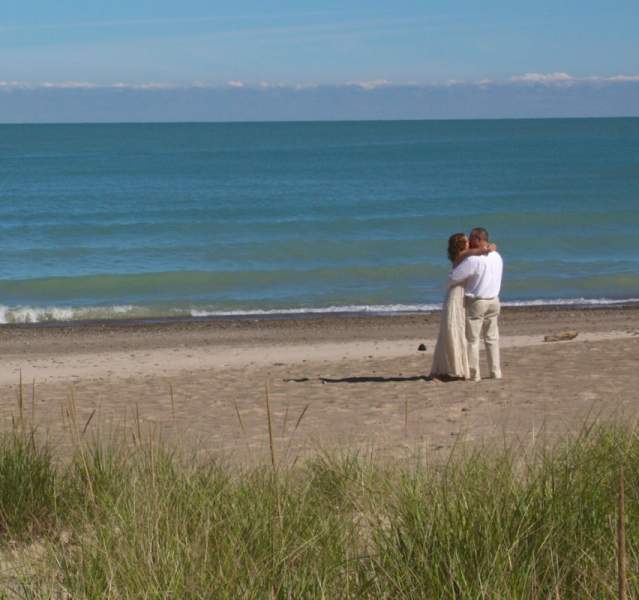 A couple kissing on the beach