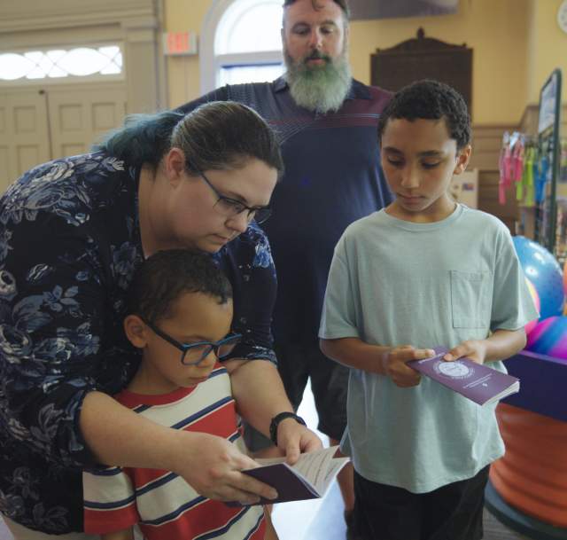 A family of four visit Fayetteville's Fascinate-U Children's Museum with their Cumberland County Destination Passport