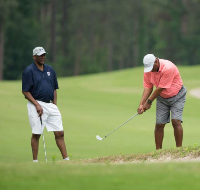 Image of two men playing golf at the Ryder Golf Course