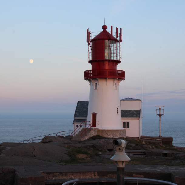 Moon over Lindesnes lighthouse in southernmost Norway